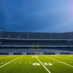 Empty football field with community support messages
